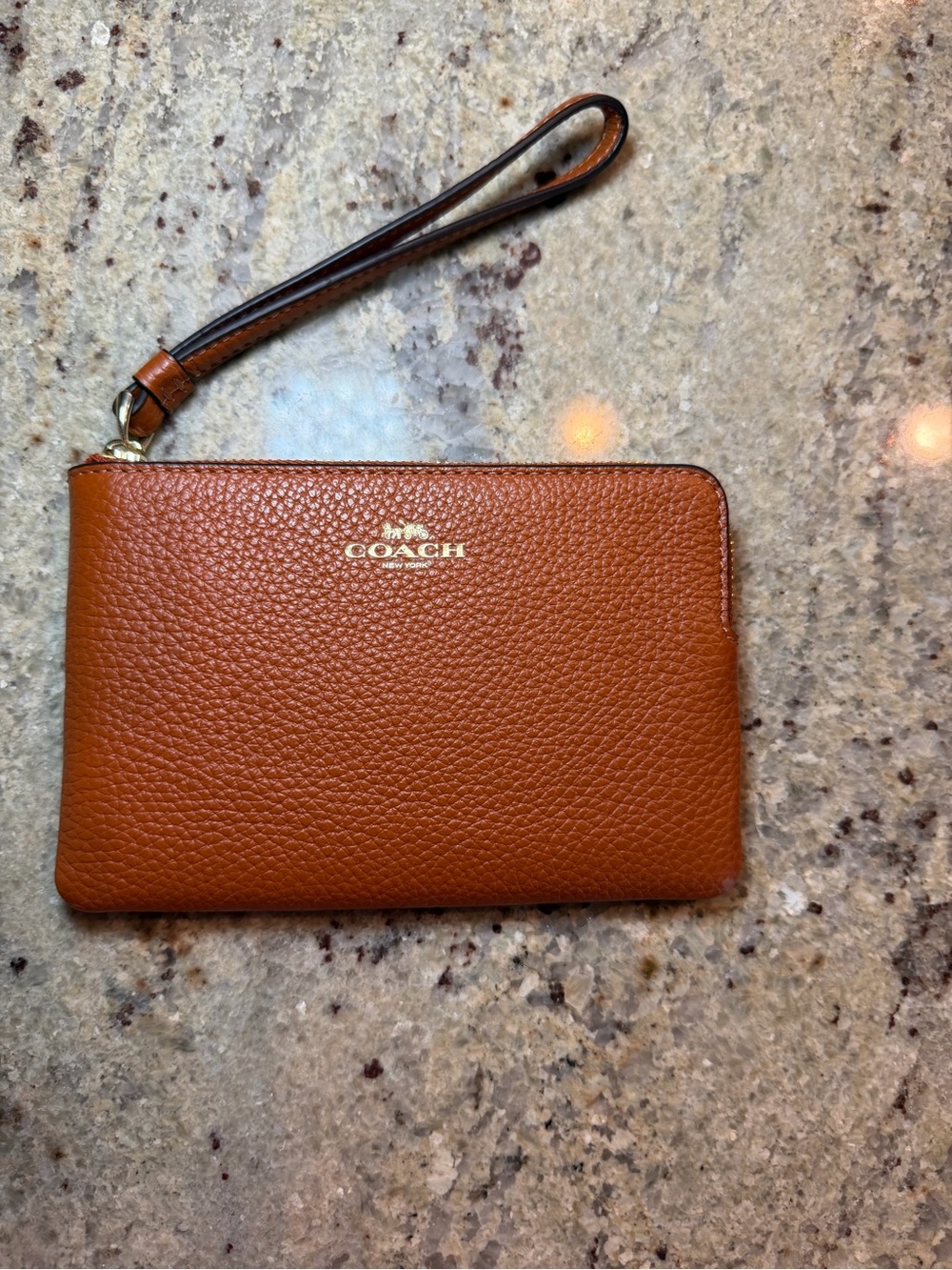 COACH Pebbled Leather Wristlet in Cognac Brown